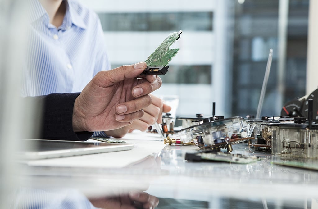 People working on circuit boards in lab